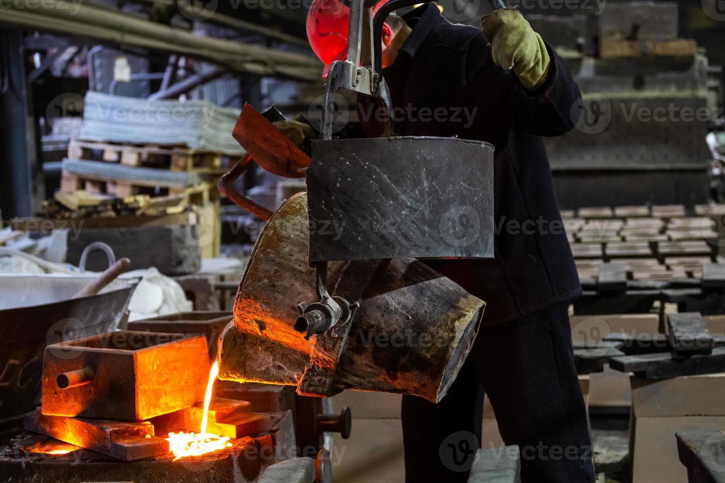 Industrial chill casting. The process of for filling out mold with molten metal. photo