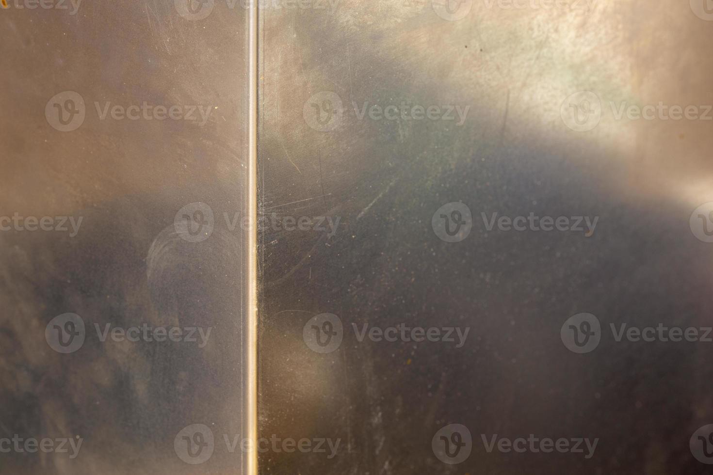 Uncoated flat cold rolled steel sheet surface with with one bent rib. Close-up with selective focus. photo