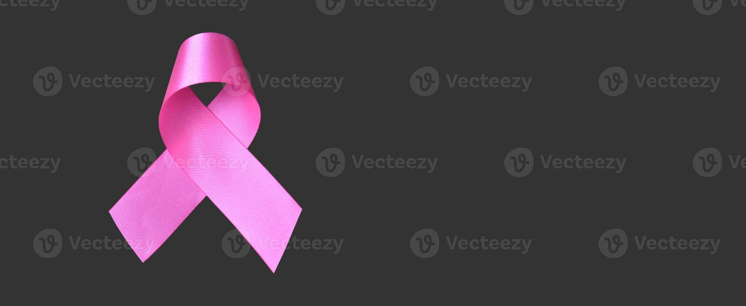 Isolated pink ribbon, symbol of female breast cancer awareness campaign in Ocotober, with clipping paths. photo