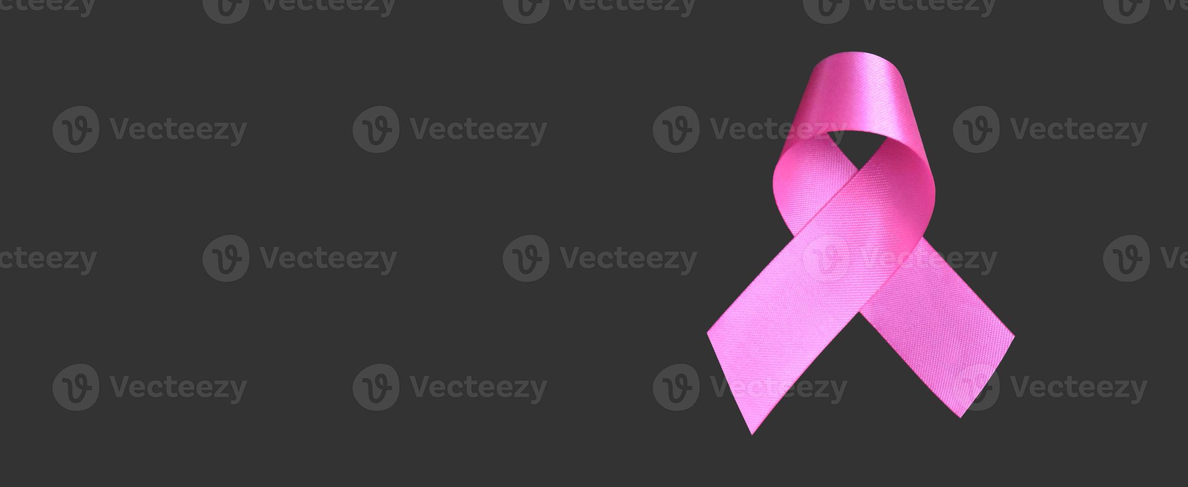 Isolated pink ribbon, symbol of female breast cancer awareness campaign in Ocotober, with clipping paths. photo