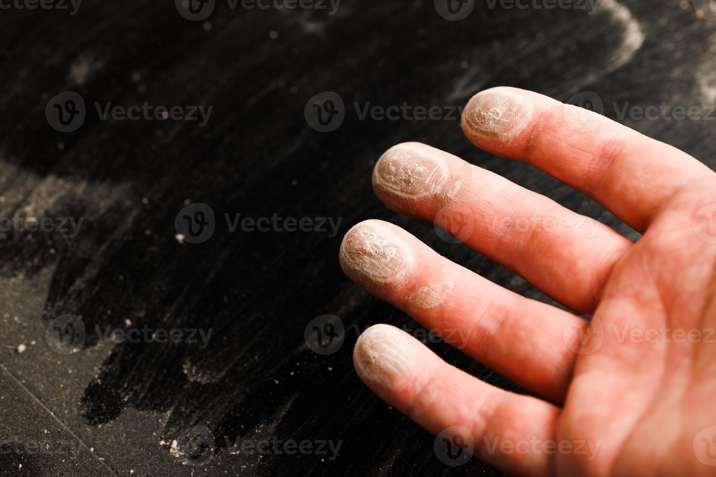 caucasian hand with dust on finger tips after touching black dusty