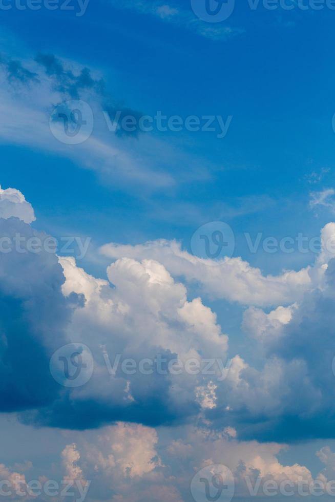 Regular summer clouds on blue sky at daylight in continental europe. Close shot wit telephoto lens photo