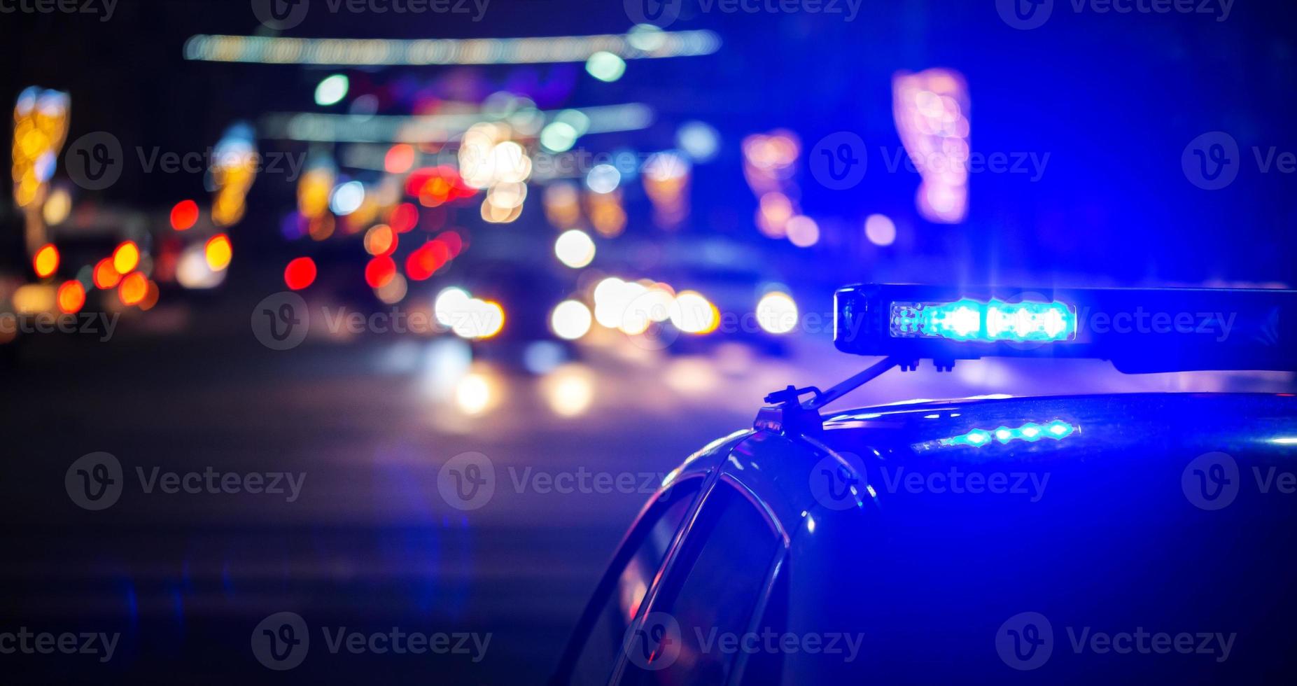 night police car lights in city - close-up with selective focus and bokeh photo