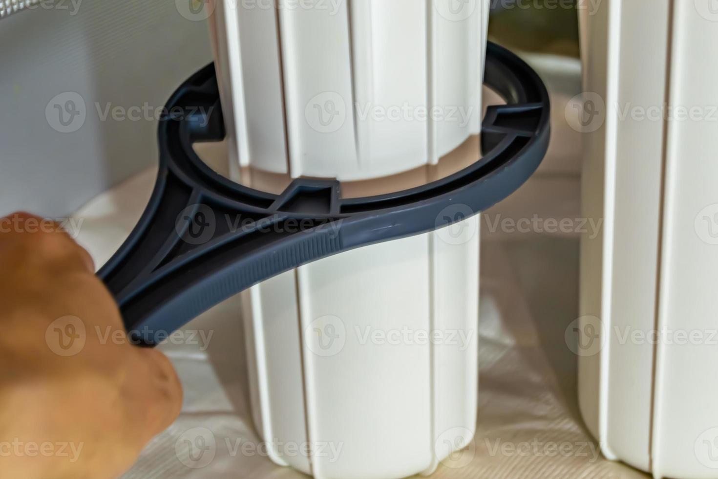 water filter cartridge for home on background kitchen photo