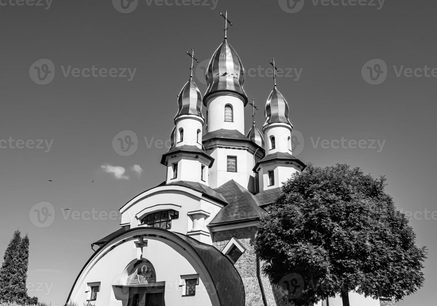 Christian church cross in high steeple tower for prayer photo