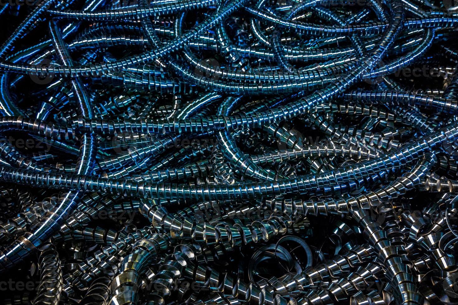 Long curly blue steel swarf closeup full-frame industrial background photo