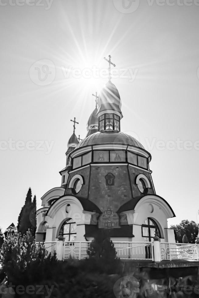 Christian church cross in high steeple tower for prayer photo