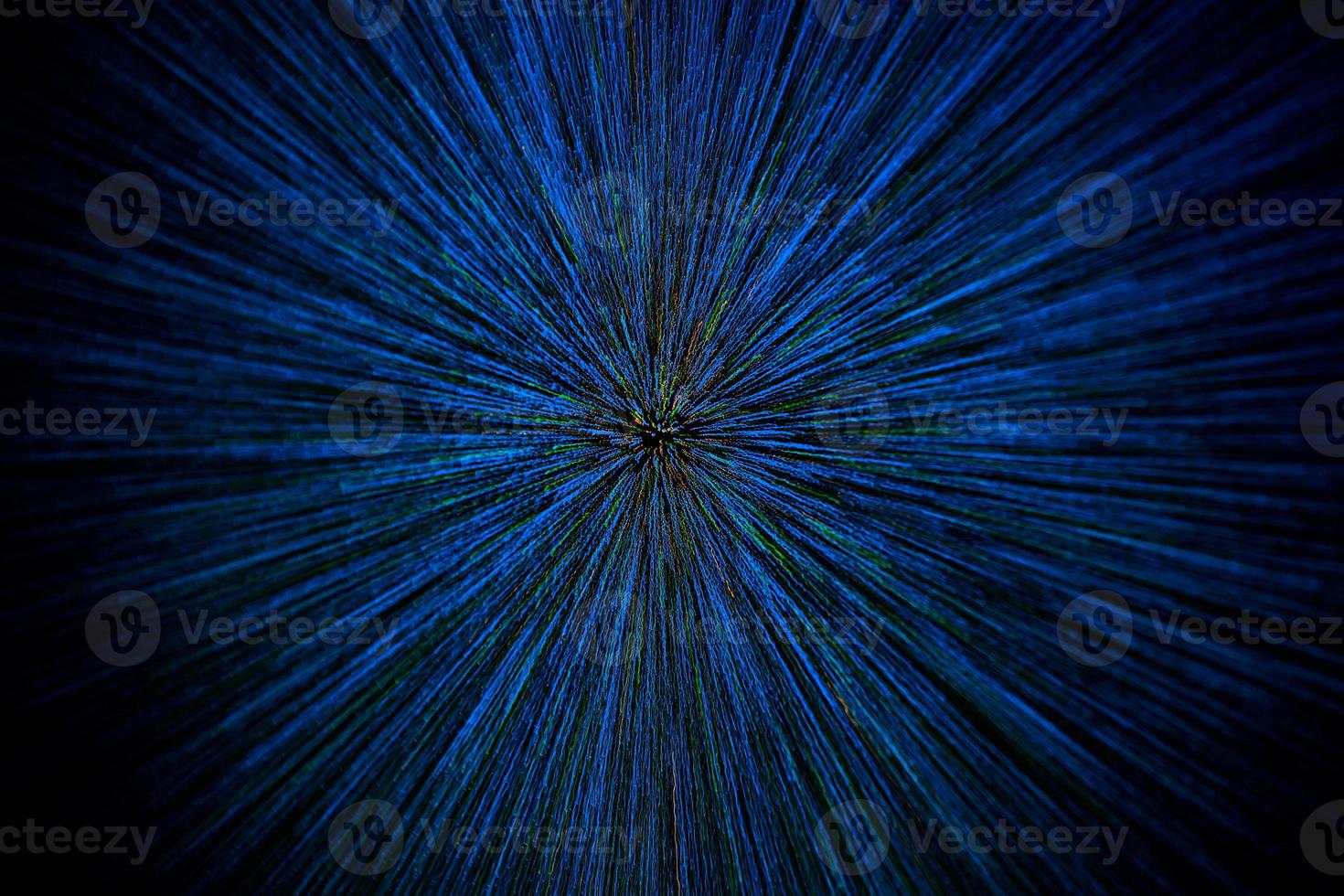 natural lens zoom explosion radial blurred blue green orange dots on black background photo