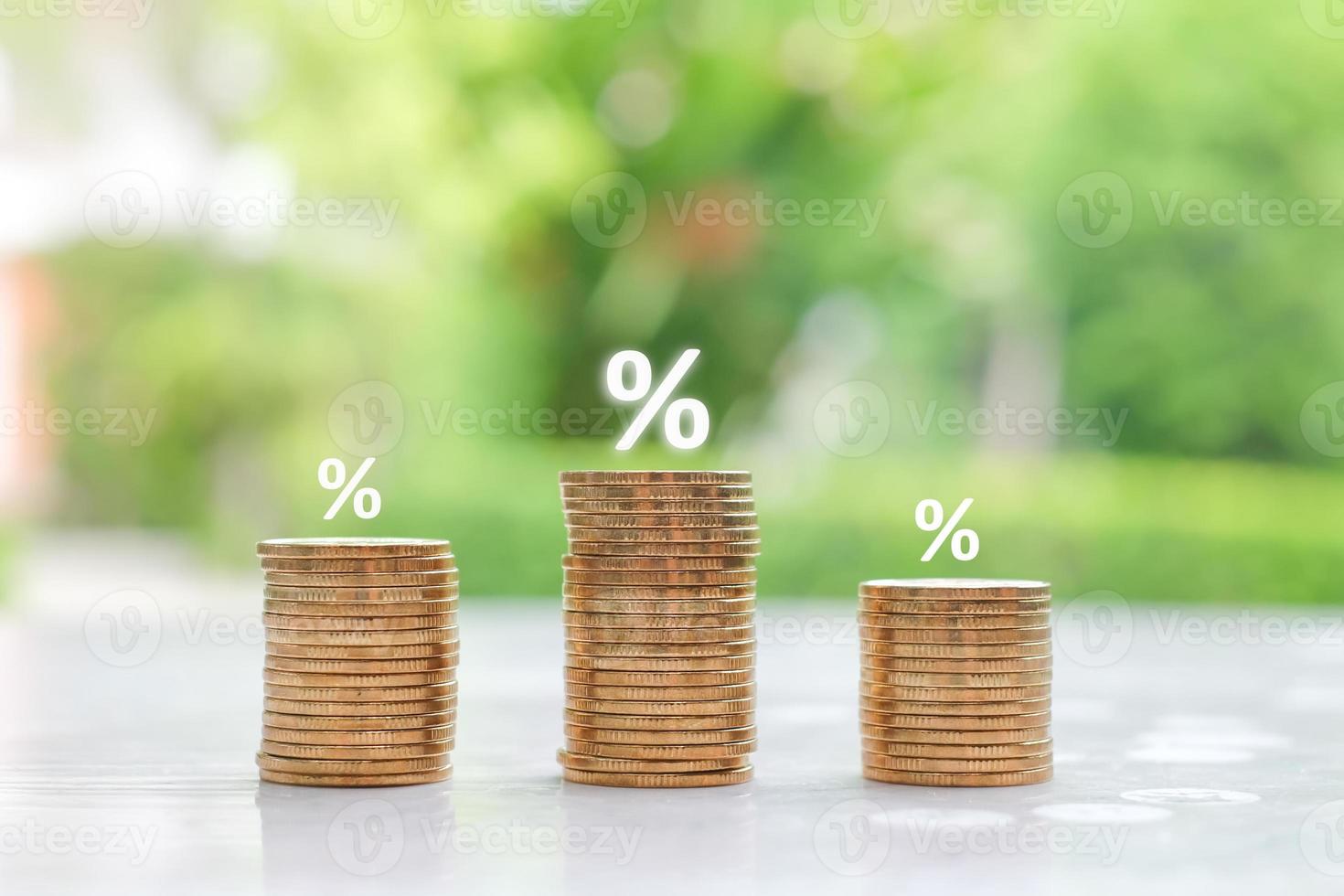 Interest rate finance and mortgage rates. Stack of money coin and percentage sign icon. financial growth, interest rate increase, inflation, sale price and tax rise concept. photo