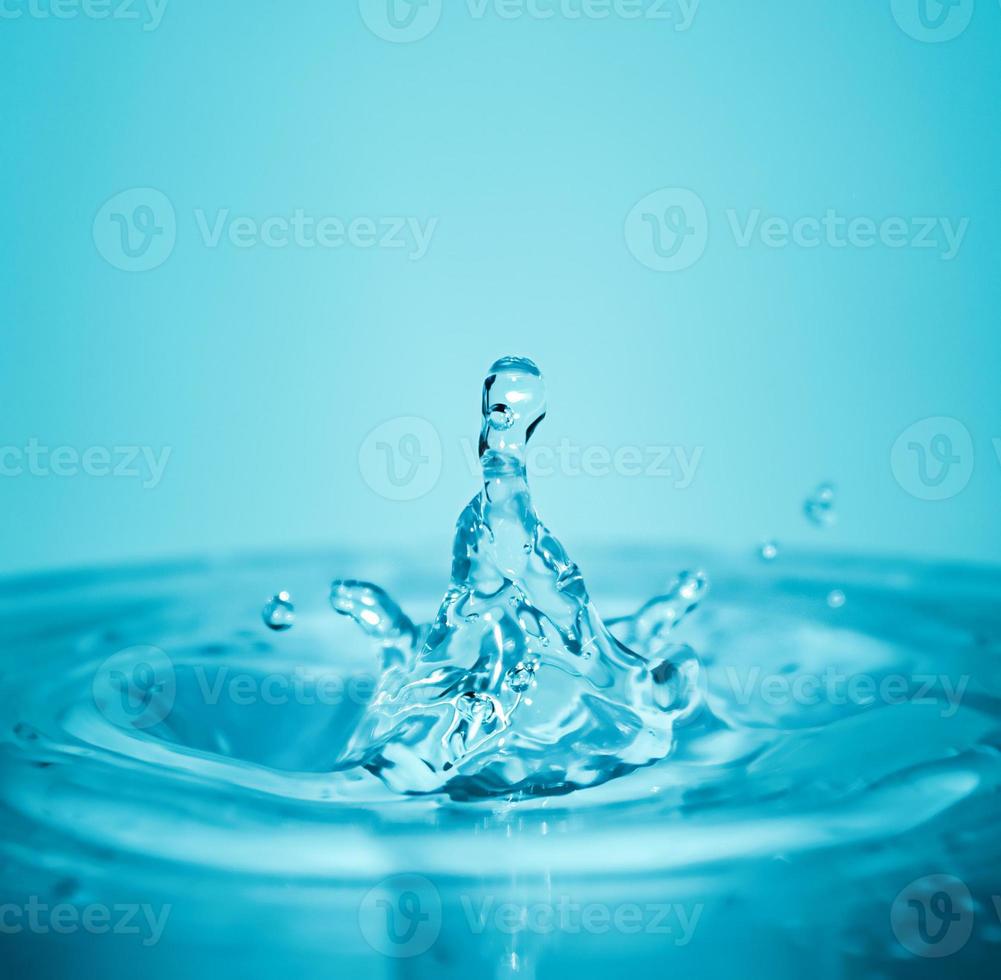 Water splash on blue background in macro photo