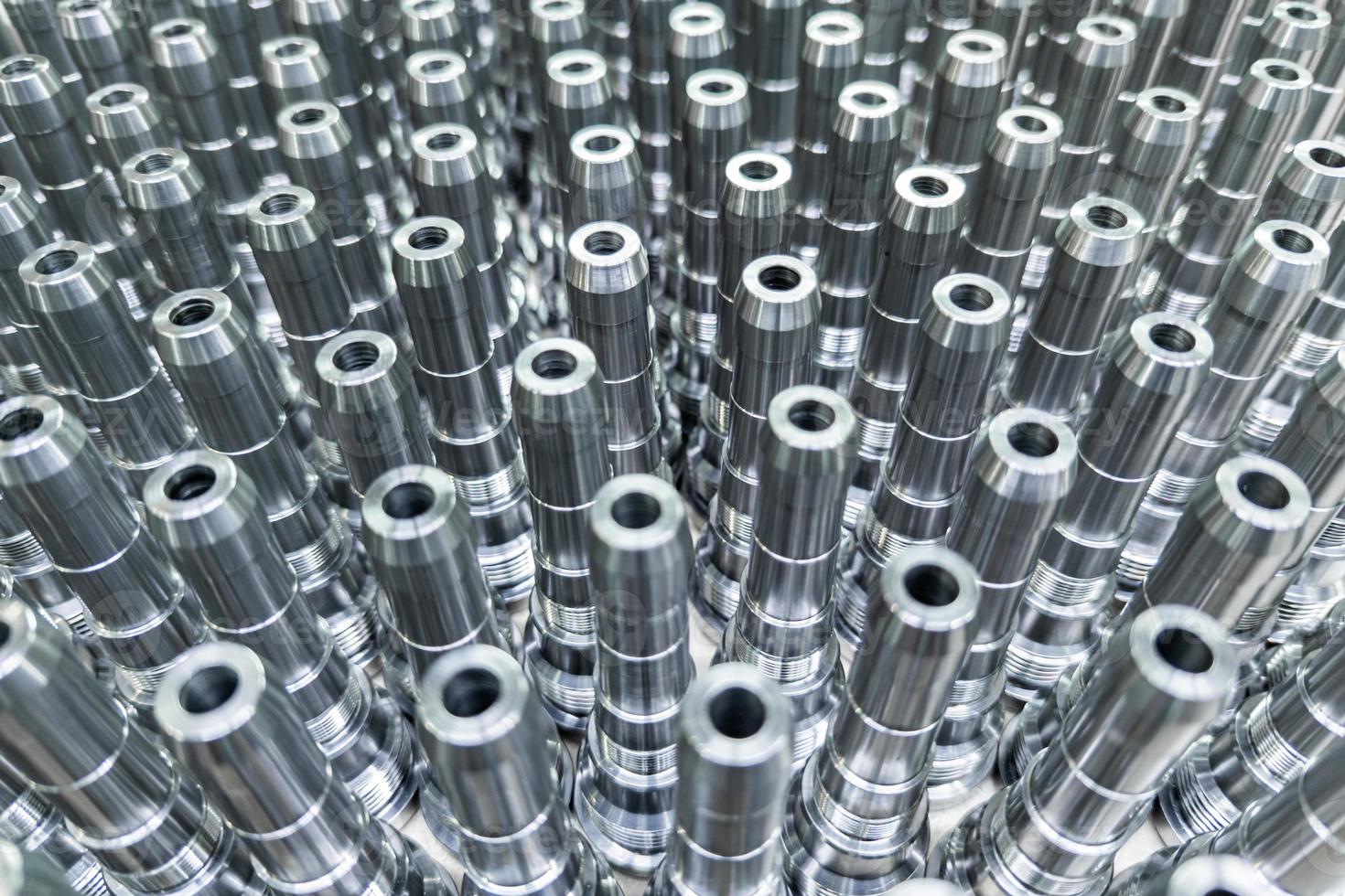 Shiny long steel parts full frame background, clean steel rods after fine cnc turning. photo