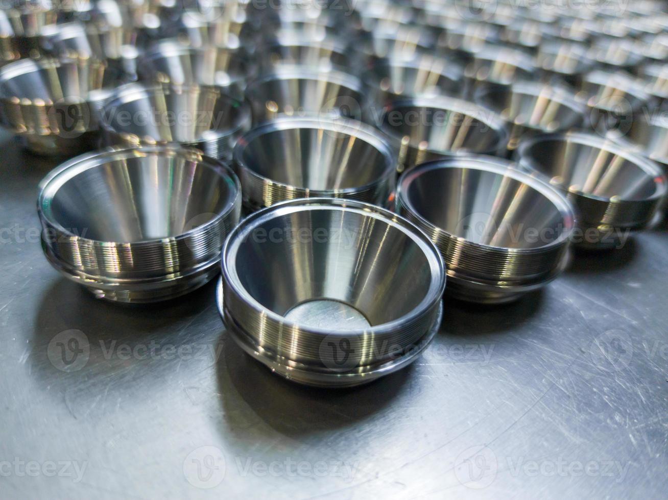 batch of shiny metal cnc aerospace parts production - close-up with selective focus for industrial background photo