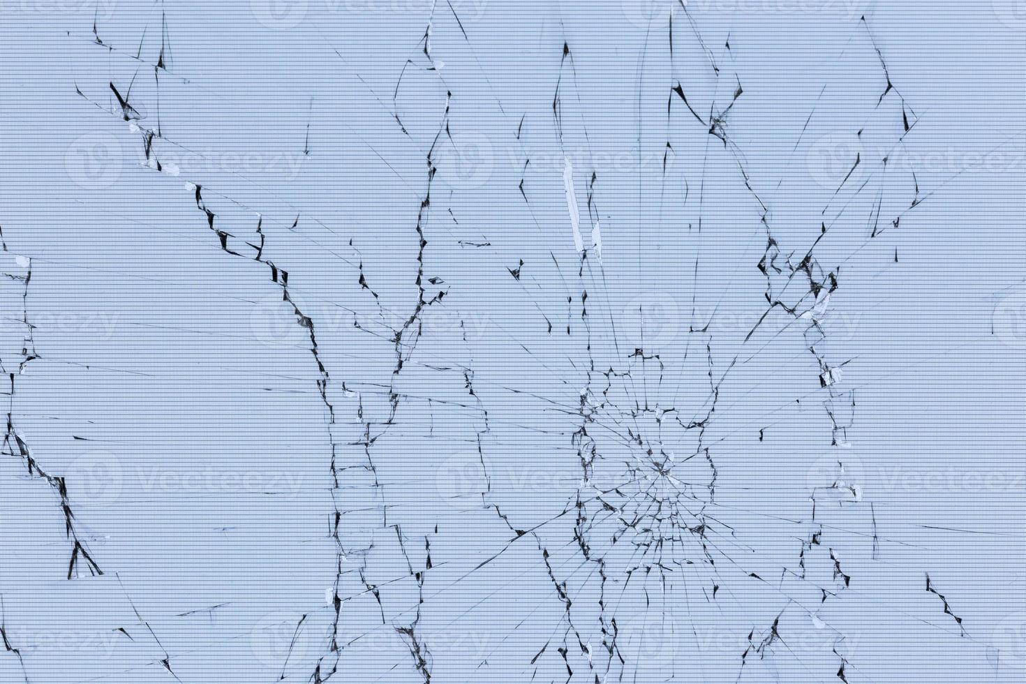 flat texture of cracked glass tft lcd screen with localized radial cracks photo