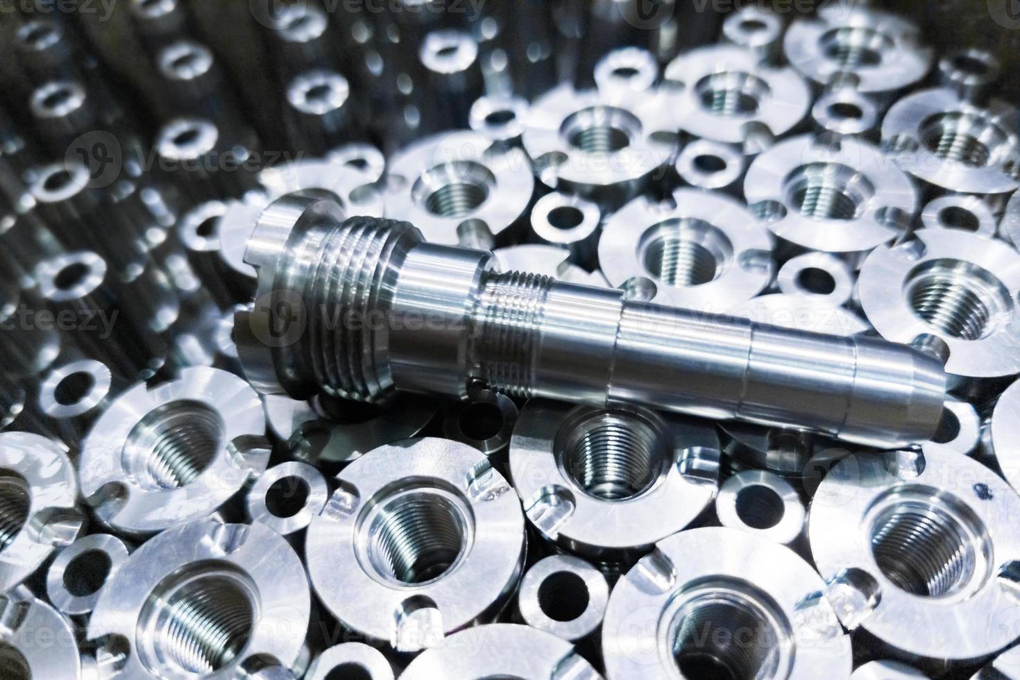 Shiny steel parts close-up background, long clean steel rods after fine cnc turning photo