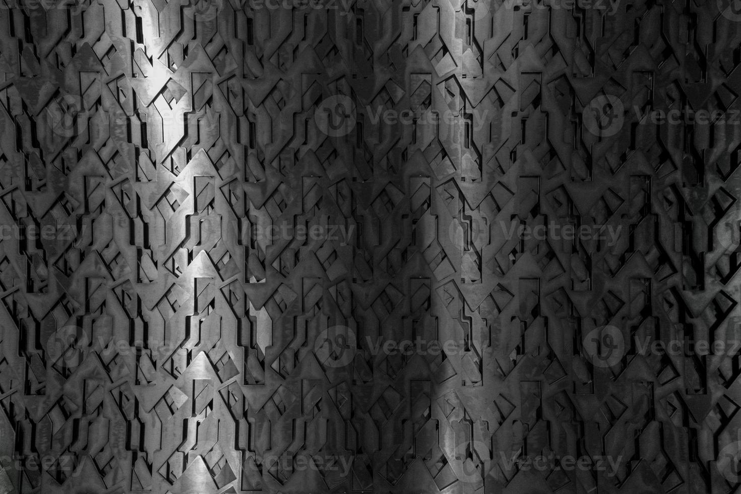 Light glow on grill pattern. Dark industrial abstract background. photo