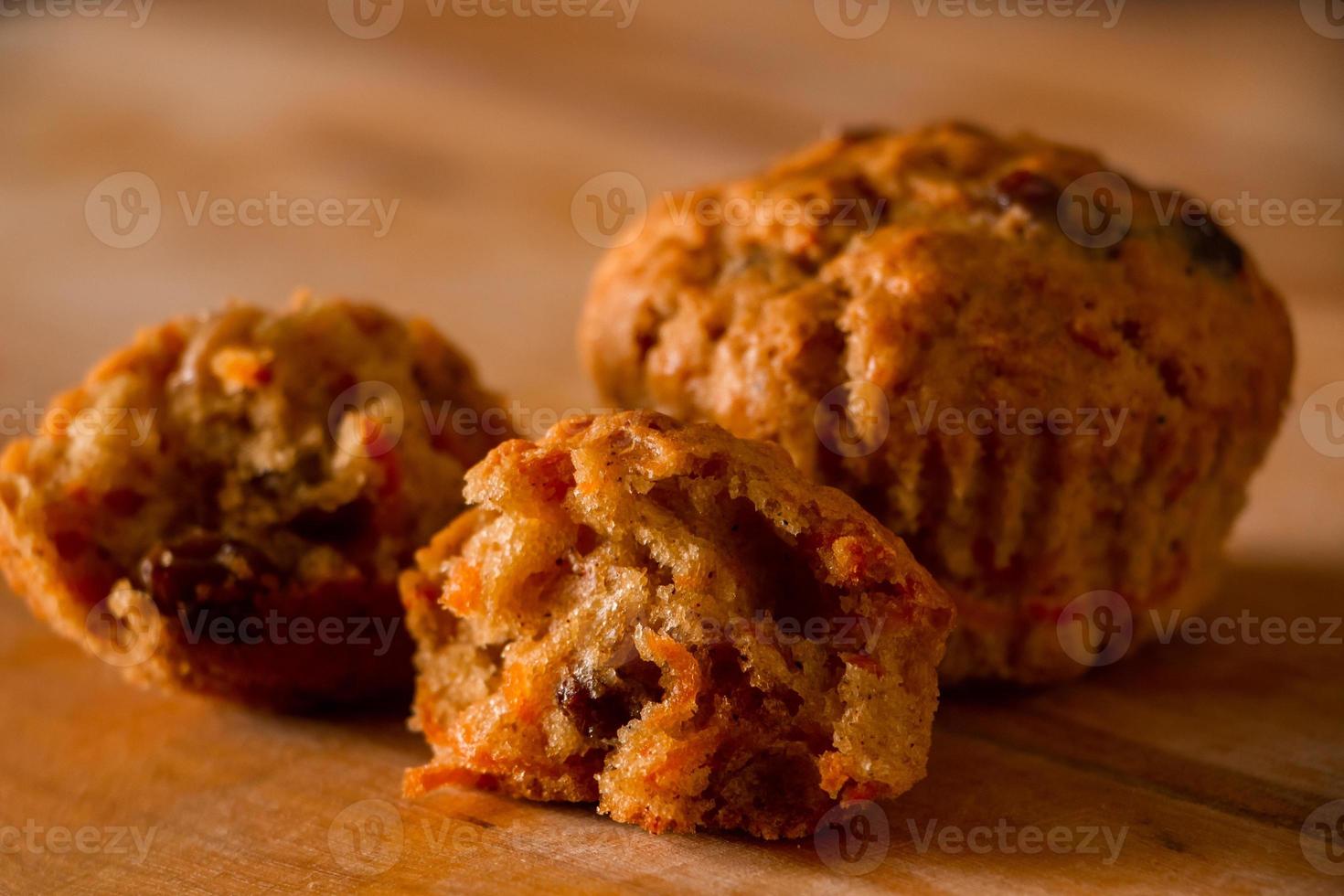 Homemade cupcakes with raisins. Traditional autumn pastries on a wooden background. photo