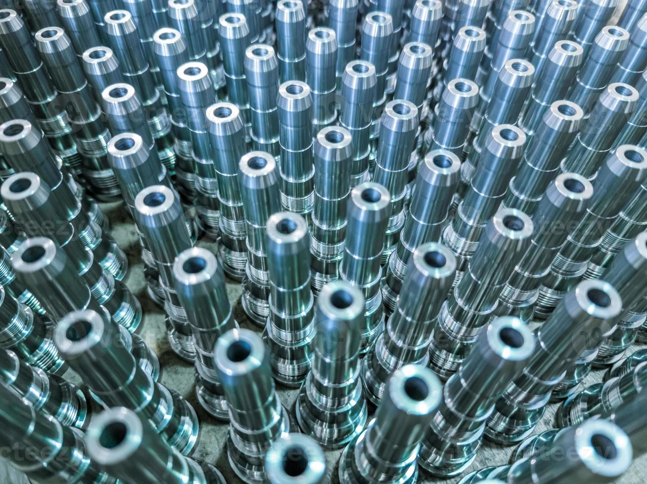 Shiny long steel parts full frame background, clean steel rods after fine cnc turning. photo