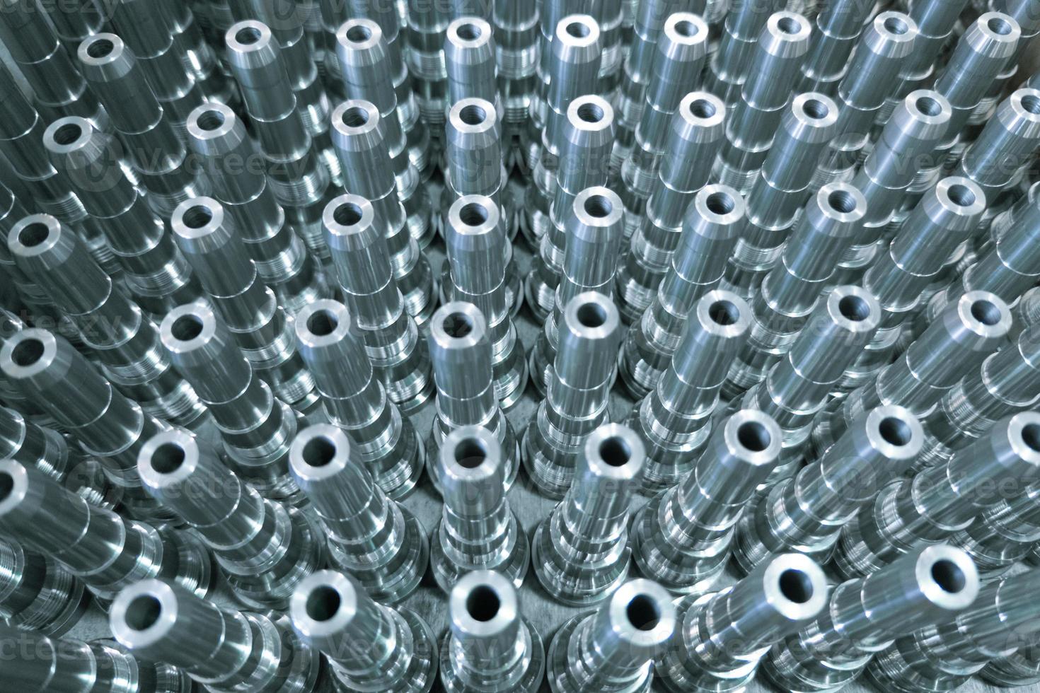 Shiny long steel parts full frame background, clean steel rods after fine cnc turning. photo