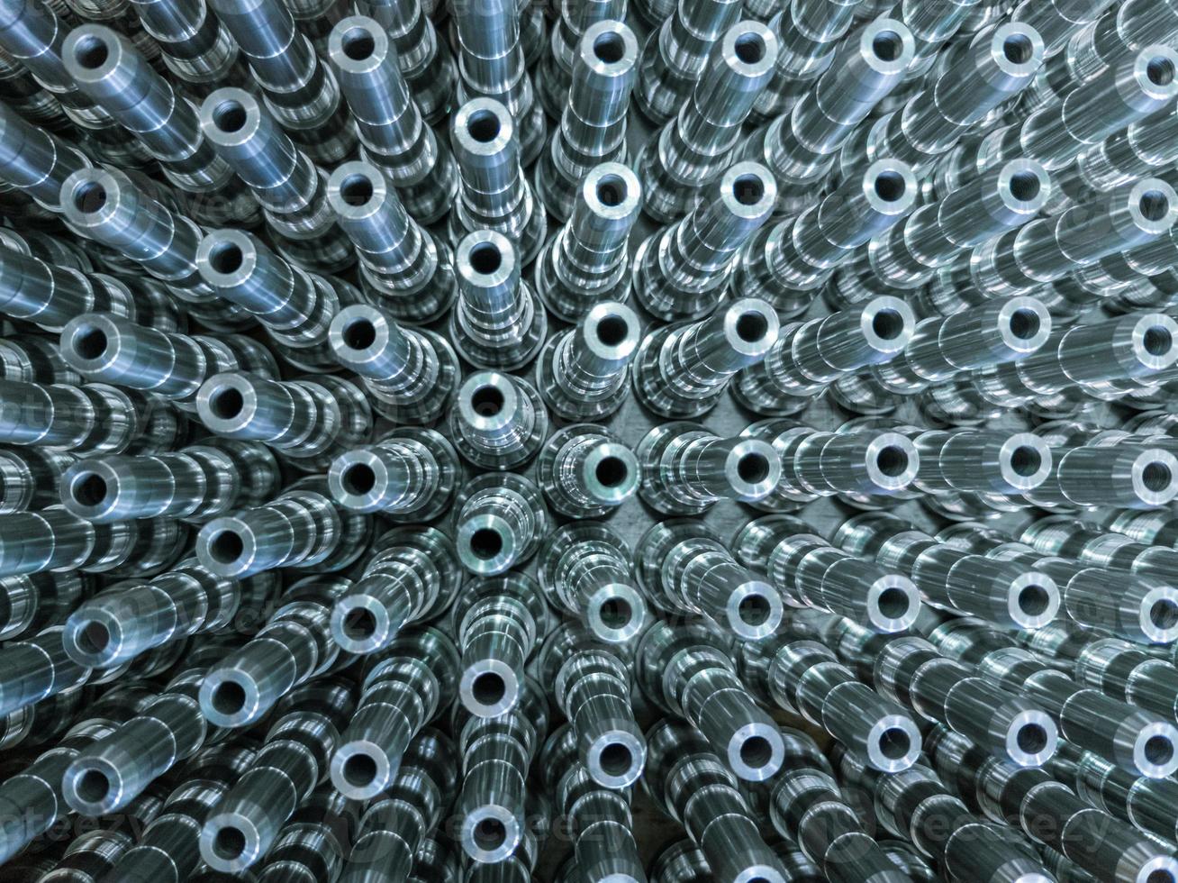 Shiny long steel parts full frame background, clean steel rods after fine cnc turning. photo