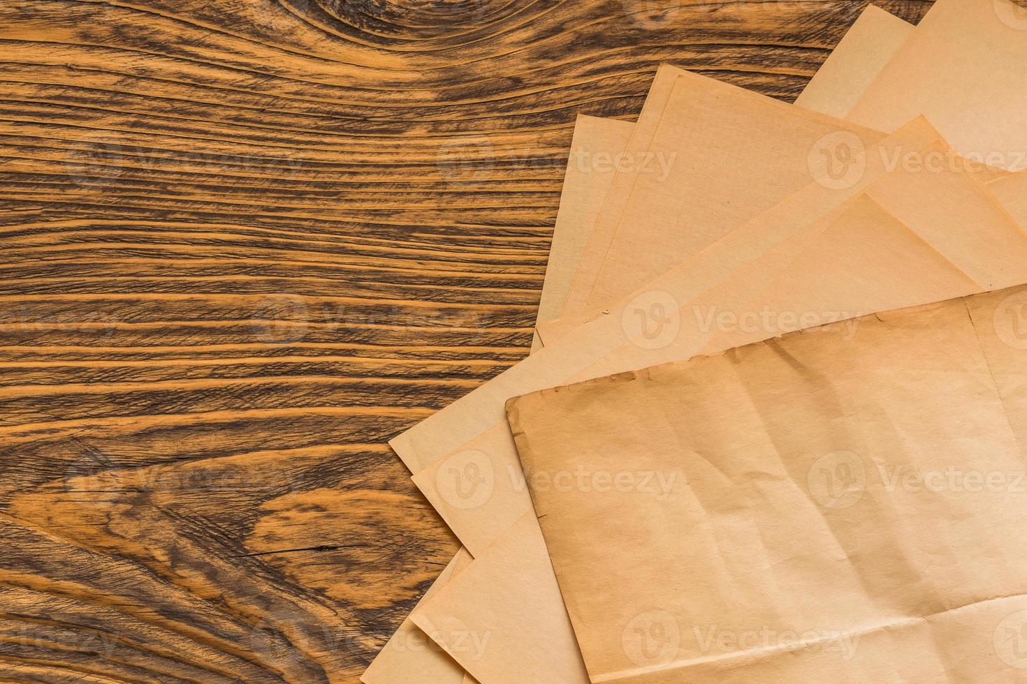 sheets of old paper on table photo