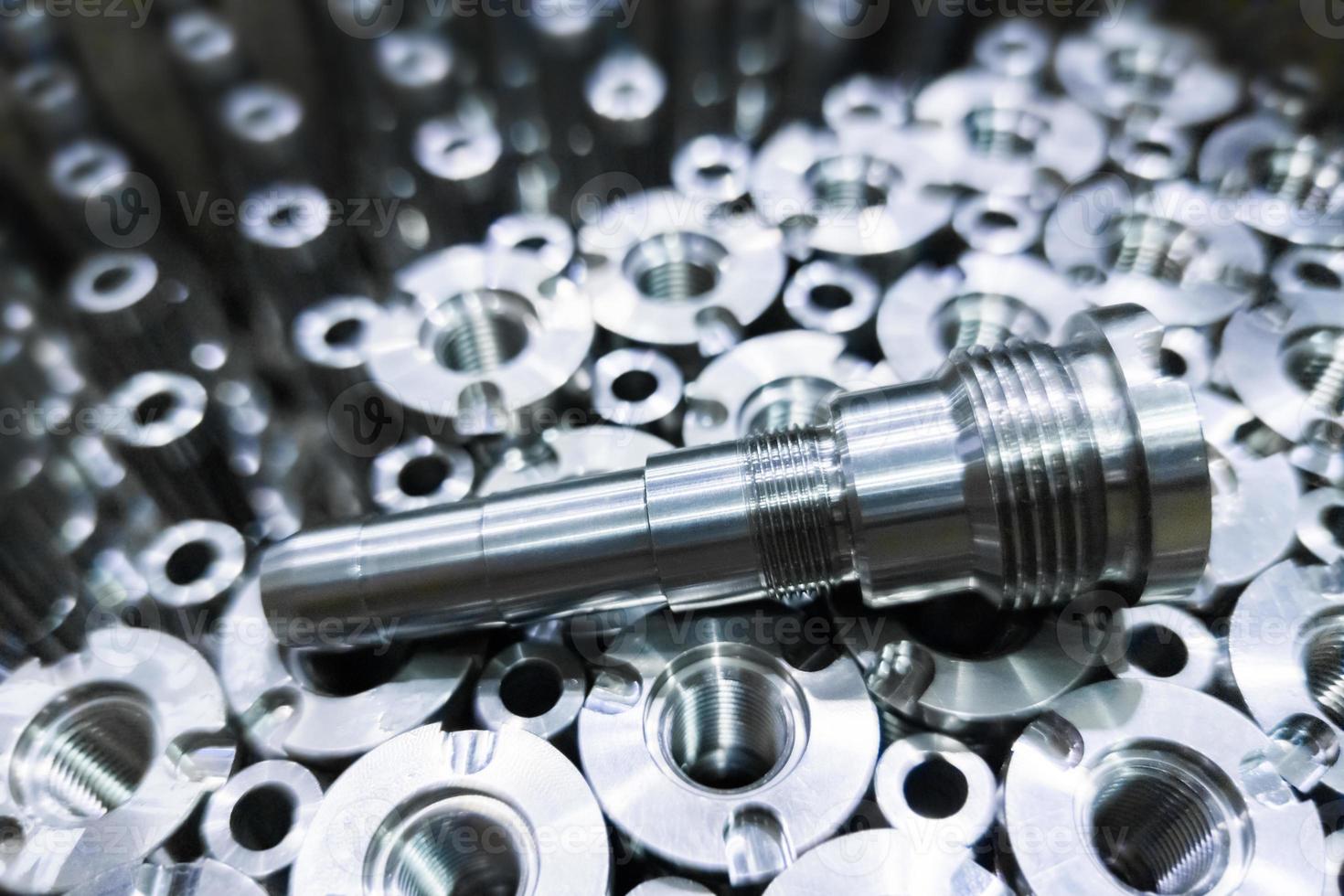 Shiny steel parts close-up background, long clean steel rods after fine cnc turning photo