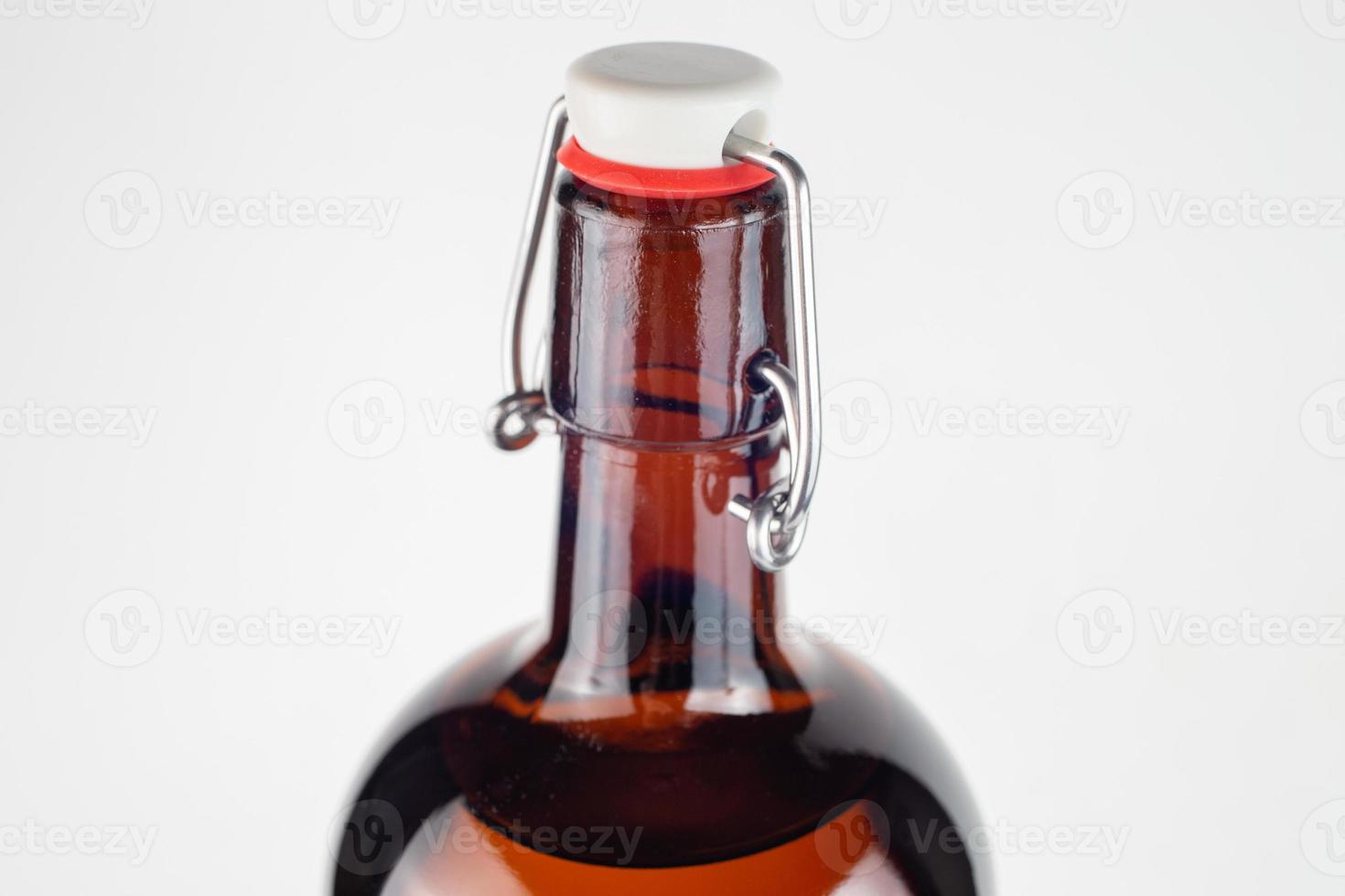 brown bottle swing top or flip-top close-up with selective focus photo