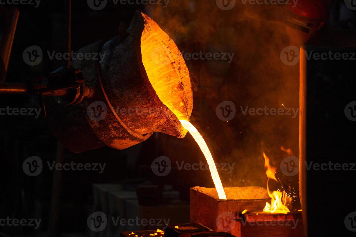 Close-up view of industrial chill casting. The process of for filling out mold with molten metal. photo