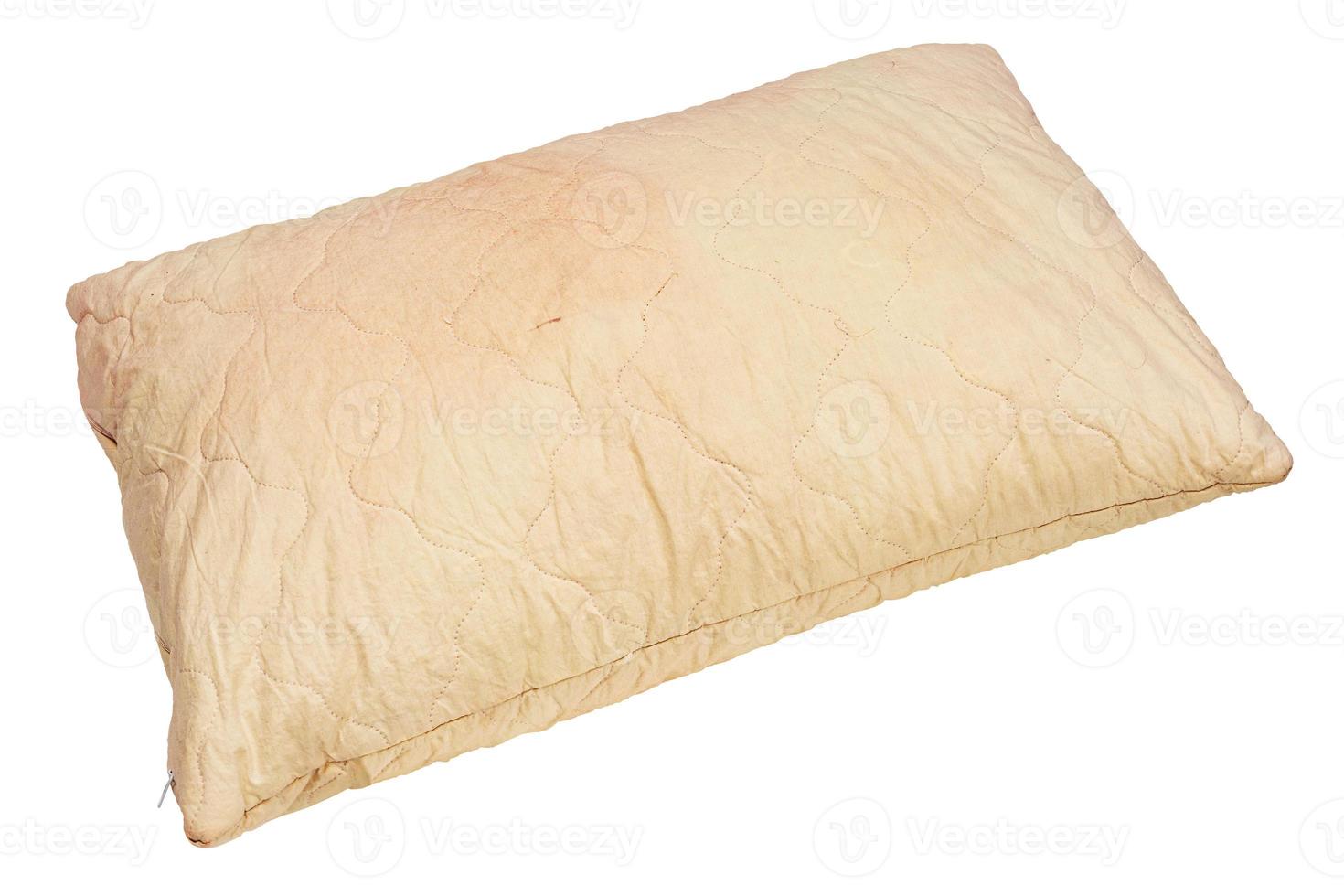 dirty used spotted pillow isolated on white background in diagonal composition photo