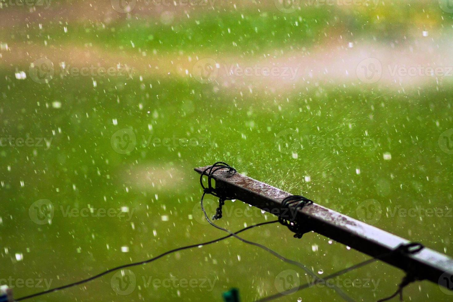 Old balcony clothes drying ropes guide at rainy day close up photo