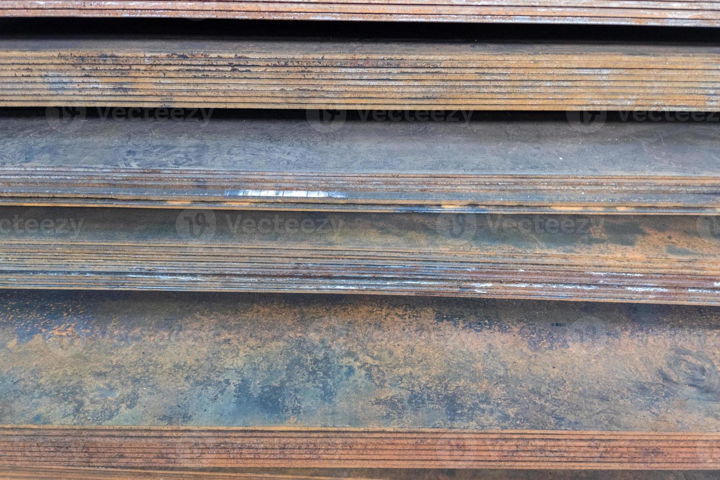 stack of mild steel sheets, full-frame close-up view with selective focus photo