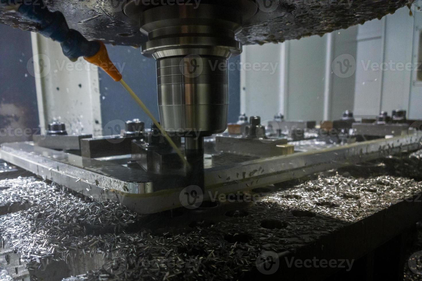 A real process of cnc milling of lagre thick metal palte. Selective focus with blur technique. photo