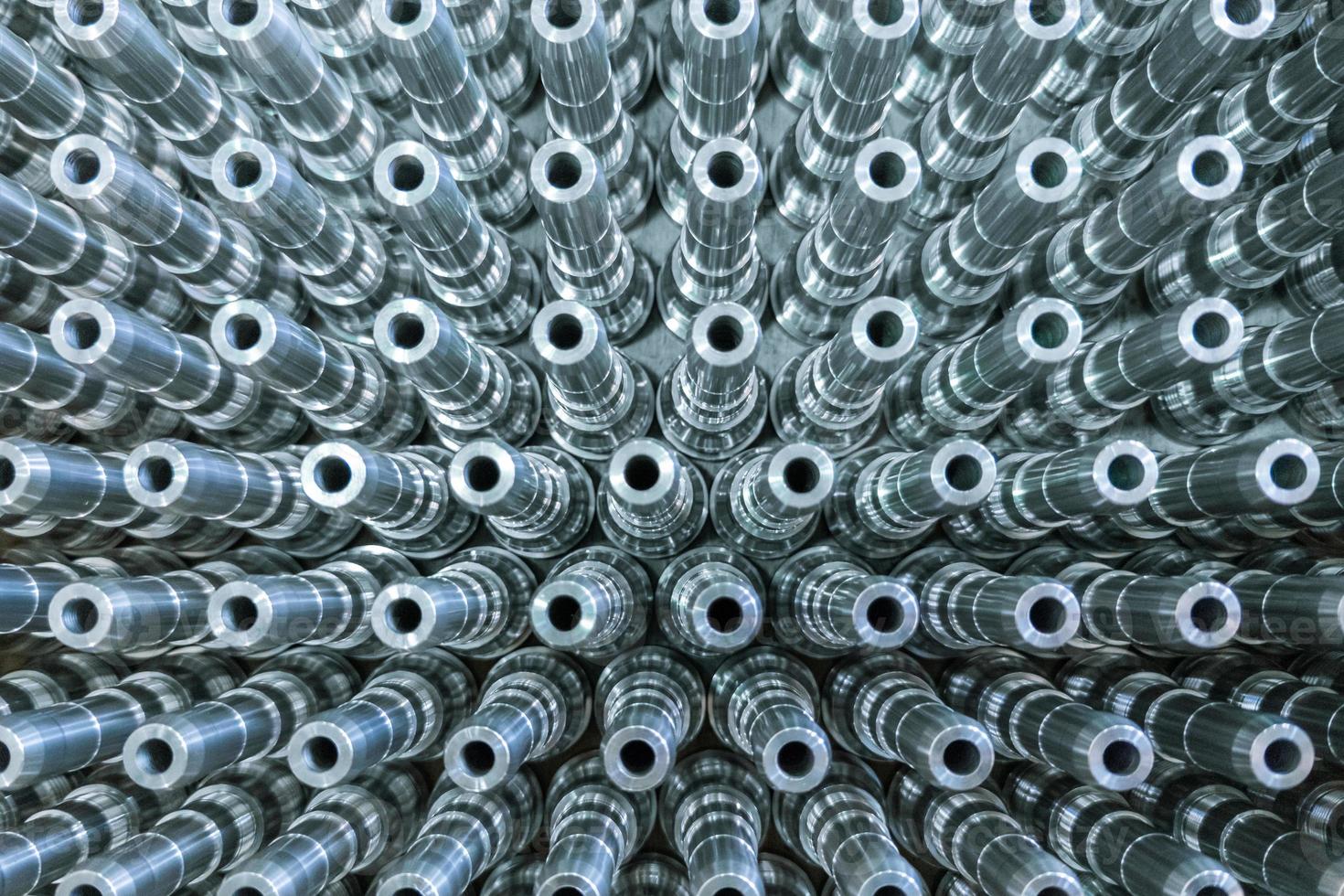 Shiny long steel parts full frame background, clean steel rods after fine cnc turning. photo