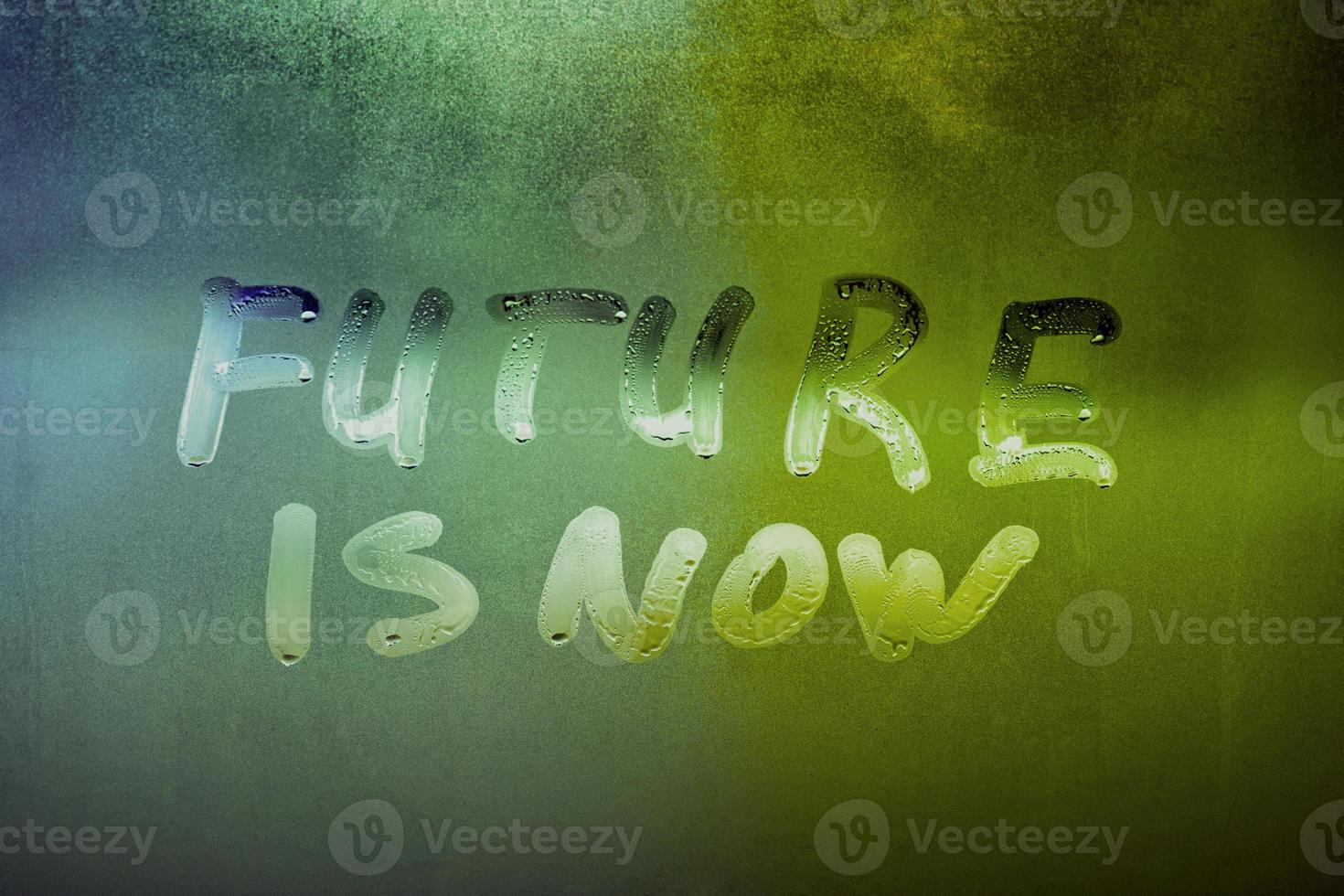 words future is now handwritten on night foggy window glass surface photo