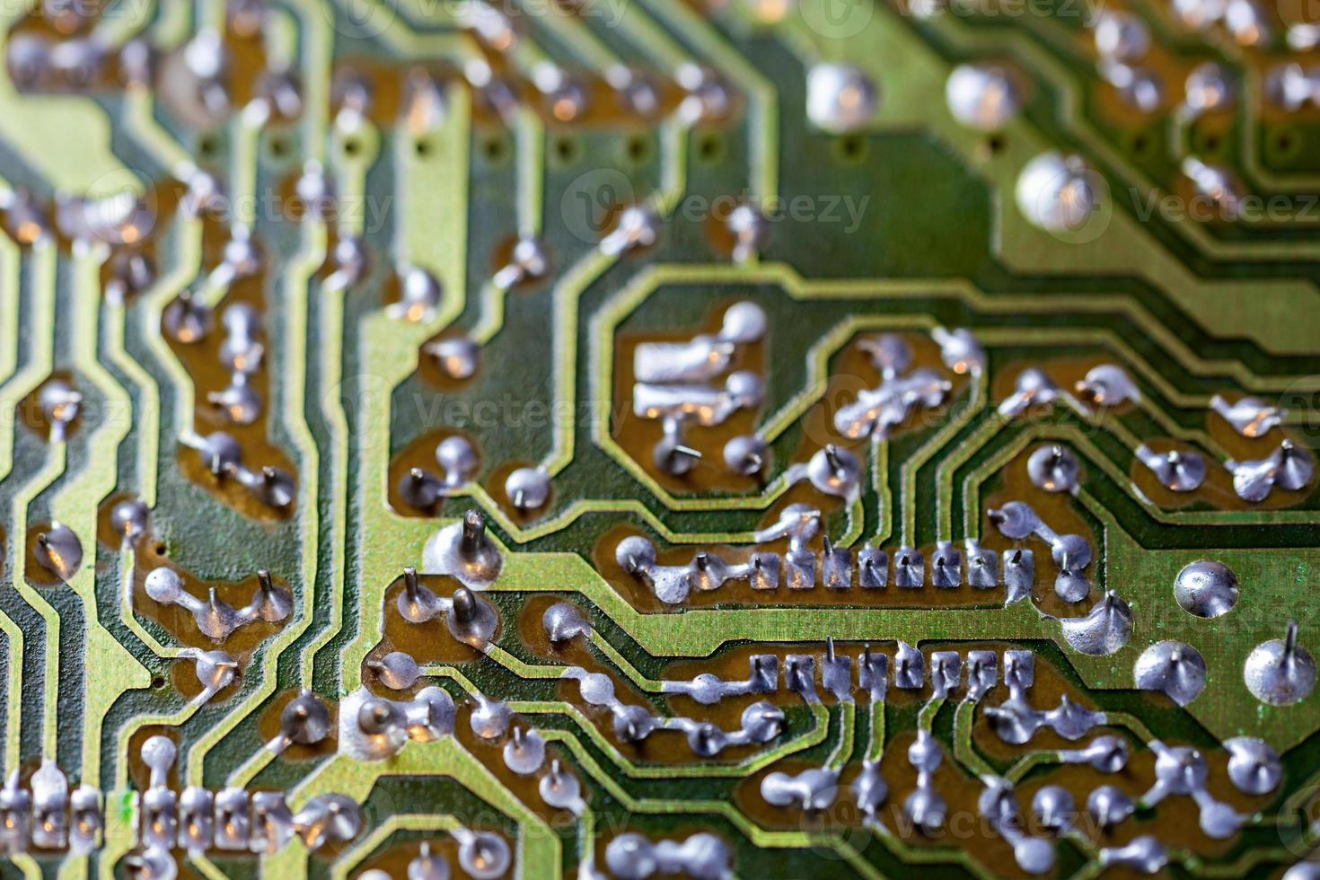 green analog pcb without components selective focus background photo