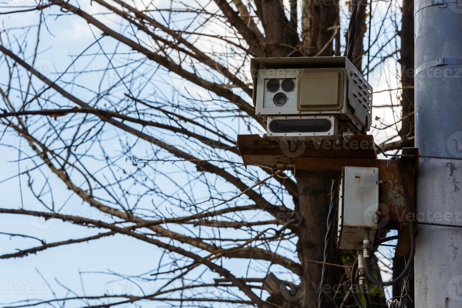 Speed radar camera detector mounted on the pole front closeup telephoto view photo