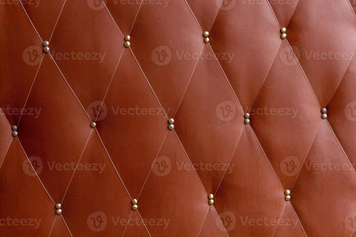 Soviet soft brown dermantine front door with a banner of fishing line and nails - full frame background and texture photo
