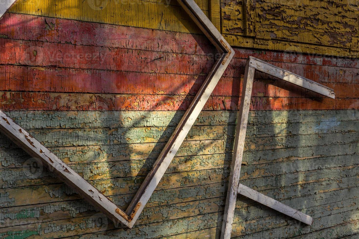 Abstract composition with a frames on old wooden wall photo
