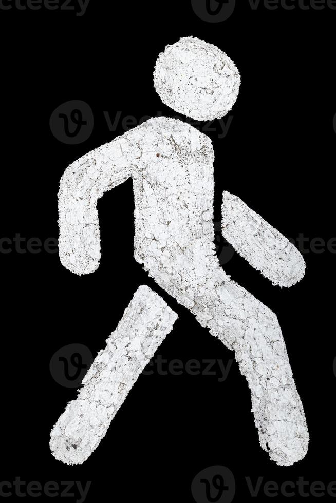 White walking person street sign on grey city asphalt road isolated on black background photo
