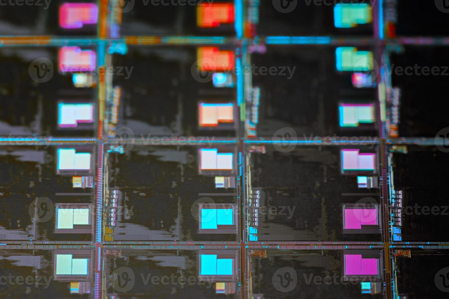 Silicon wafer with microchips used in electronics for the fabrication of integrated circuits. Full-frame high-tech macro background. photo