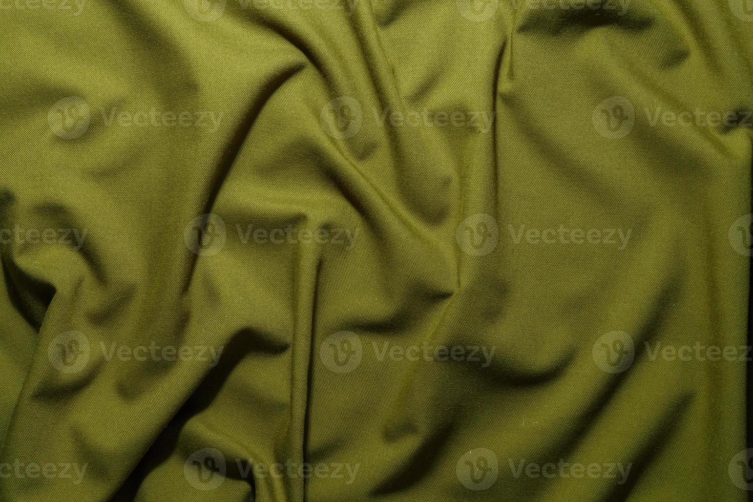 crumpled olive green crumpled tan khaki canvas fabric - full frame background and texture photo