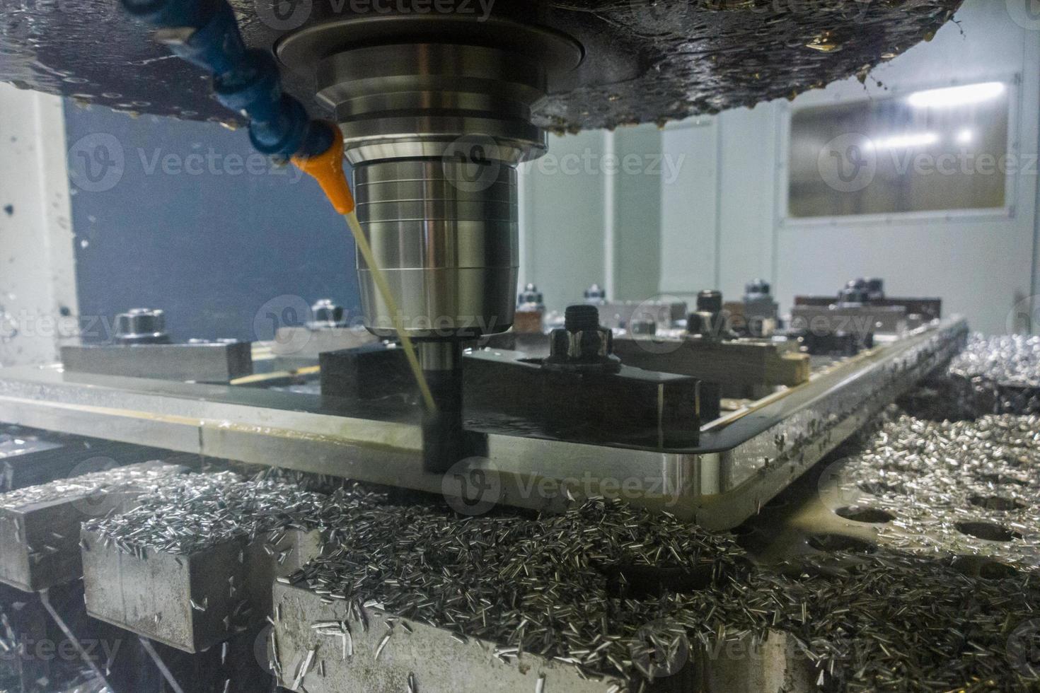 A real process of cnc milling of lagre thick metal palte. Selective focus with blur technique. photo