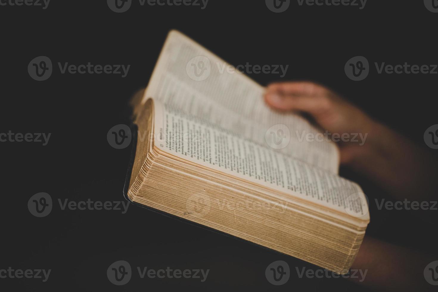 Young woman person hand holding holy bible with study at home. Adult female christian reading book in church. Girl learning religion spirituality with pray to god. concept of student education faith. photo