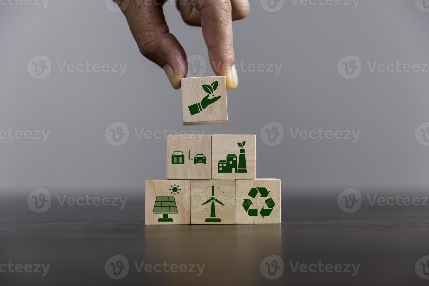 Companies are targeting net zero greenhouse gas emissions. Carbon credit concept.Tradable certificate to drive industry in direction of low emissions in efficiency cost. Wooden cubes with decrease CO2 photo