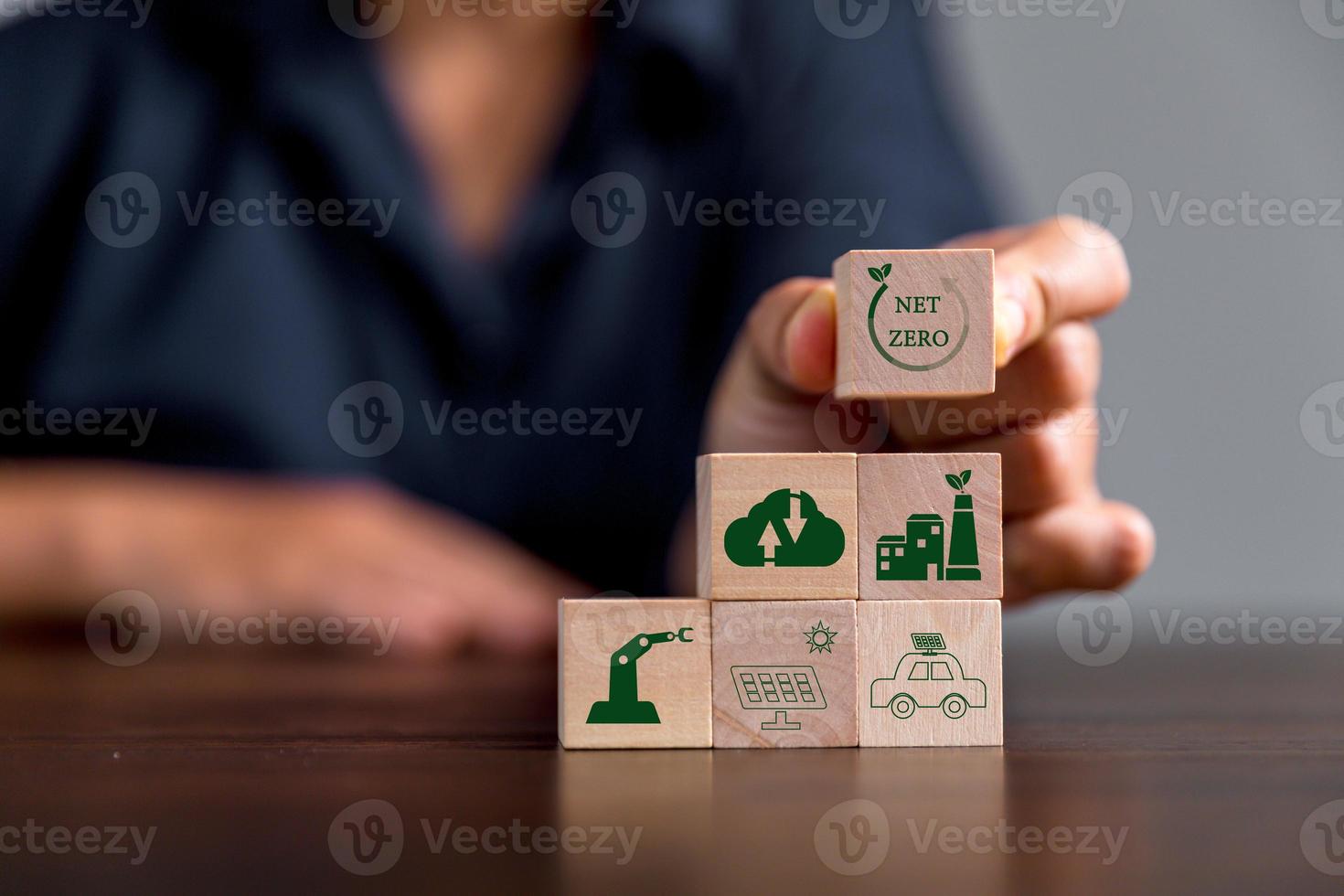 Companies are targeting net zero greenhouse gas emissions. Carbon credit concept.Tradable certificate to drive industry in direction of low emissions in efficiency cost. Wooden cubes with decrease CO2 photo