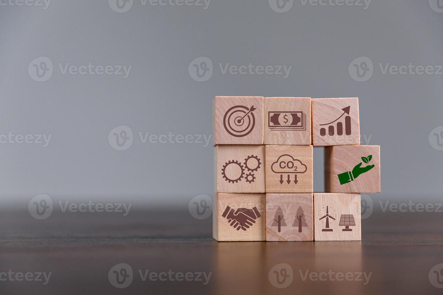 Companies are targeting net zero greenhouse gas emissions. Carbon credit concept.Tradable certificate to drive industry in direction of low emissions in efficiency cost. Wooden cubes with decrease CO2 photo
