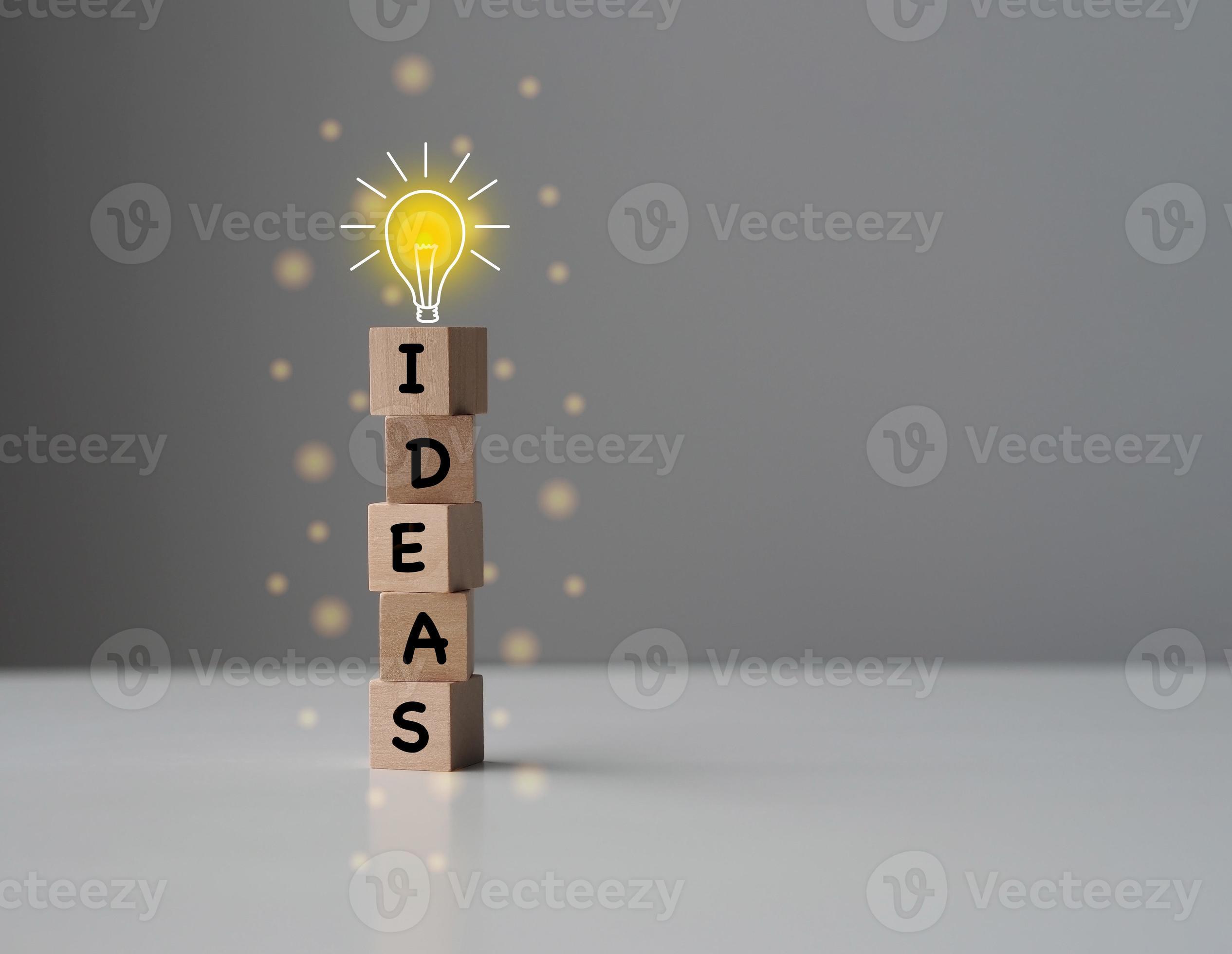 Wooden cube with the word ideas on surface Creative and inspiration