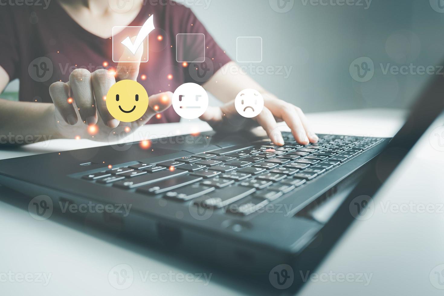 Concept of customer satisfaction and service, businesswoman using laptop to express their opinions, answers and satisfied scores. photo