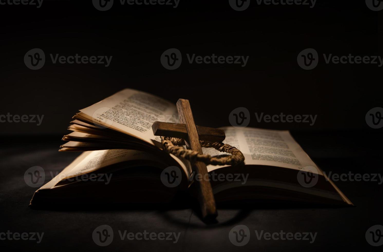 Spirituality, Religion and Hope Concept. Holy Bible and Cross on Desk. Symbol of Humility, Supplication,Believe and Faith for Christian People photo