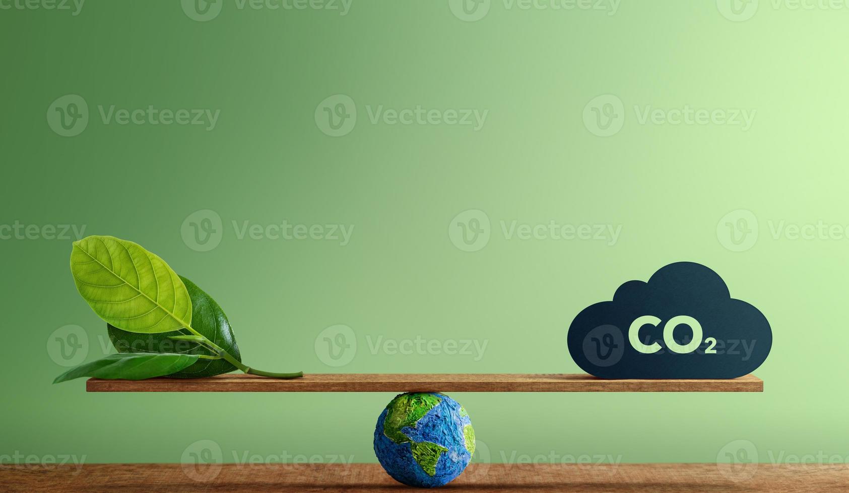 Carbon Neutral and ESG Concepts. Carbon Emission, Clean Energy. Globe Balancing between a Green leaf and CO2. Sustainable Resources, Big deal for Company and Indstry to Concern about Environmental photo