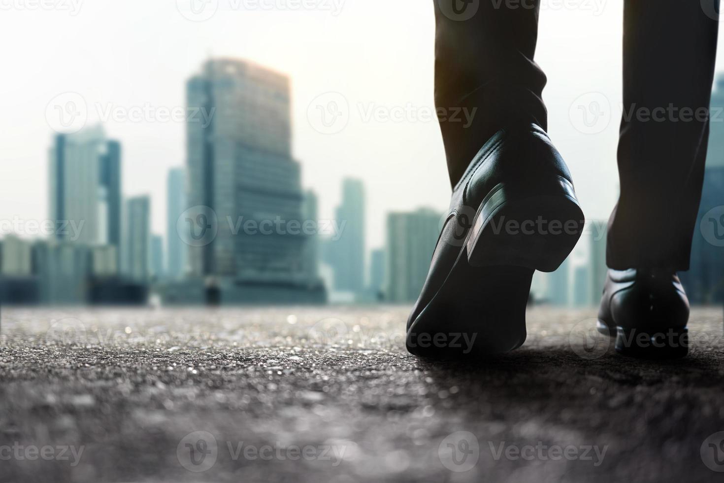 Motivation, Steps Forward into a Successful Concept. Challenging in Business and Career. Low Section of Businessman Walking on Street to City. photo